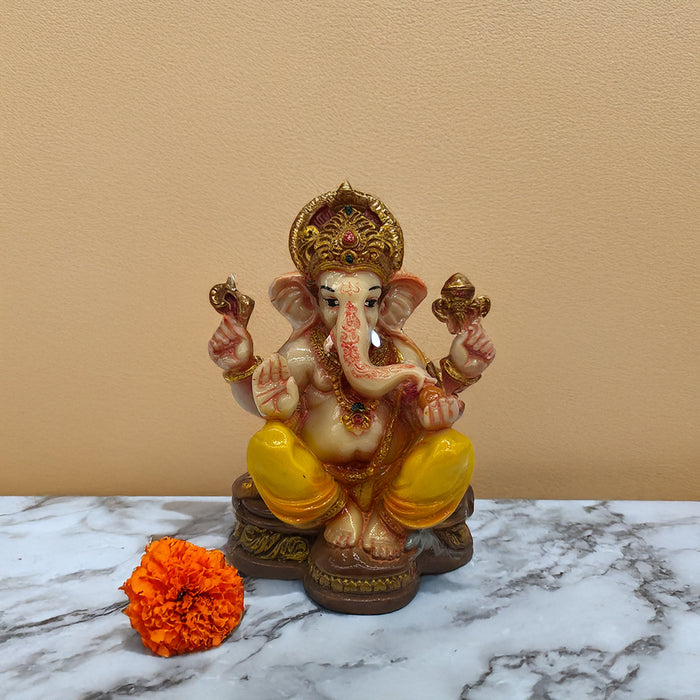 Auspicious Yellow-Adorned Ganesh Idol for Prosperity and Devotion