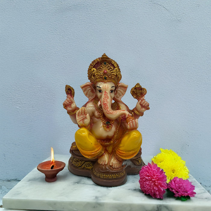 Auspicious Yellow-Adorned Ganesh Idol for Prosperity and Devotion
