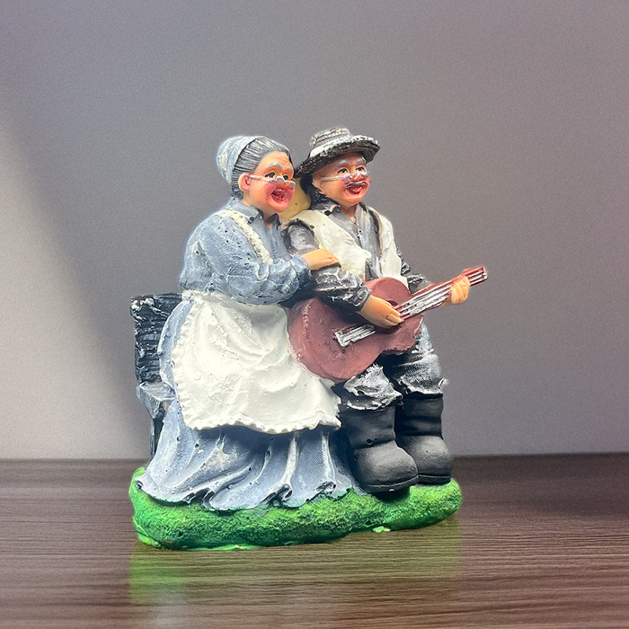 Timeless Duet: Musical Elderly Couple Sculpture for Indian Home Décor