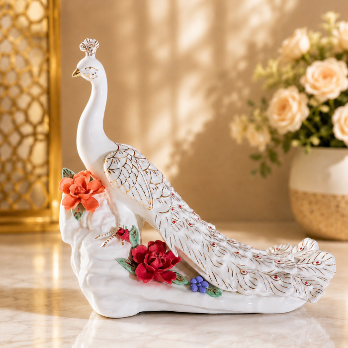 Ceramic peacock statue with golden feather detailing