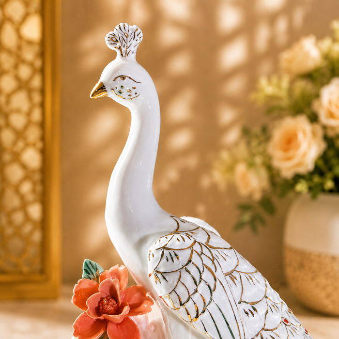White peacock decor statue on decorative base