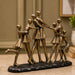 Detailed close-up of hand-painted accents, fine facial detailing, and premium Resin texture on Abstract Dancing Family Holding Hands Bronze Resin Sculpture (9 Inch)