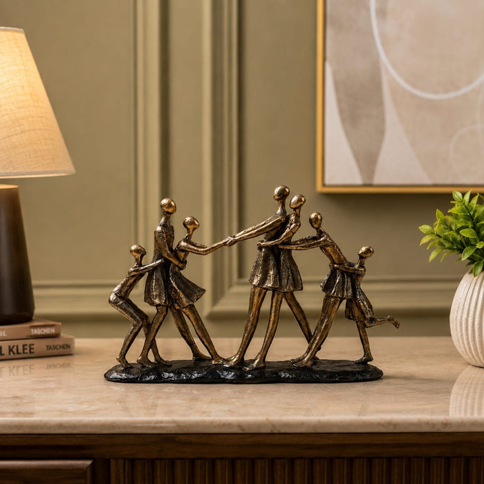 Full front view of Abstract Dancing Family Holding Hands Bronze Resin Sculpture (9 Inch) on display base against clean studio background