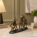 Side profile perspective showcasing elegant three-dimensional contours and sculptural depth of Abstract Dancing Family Holding Hands Bronze Resin Sculpture (9 Inch)