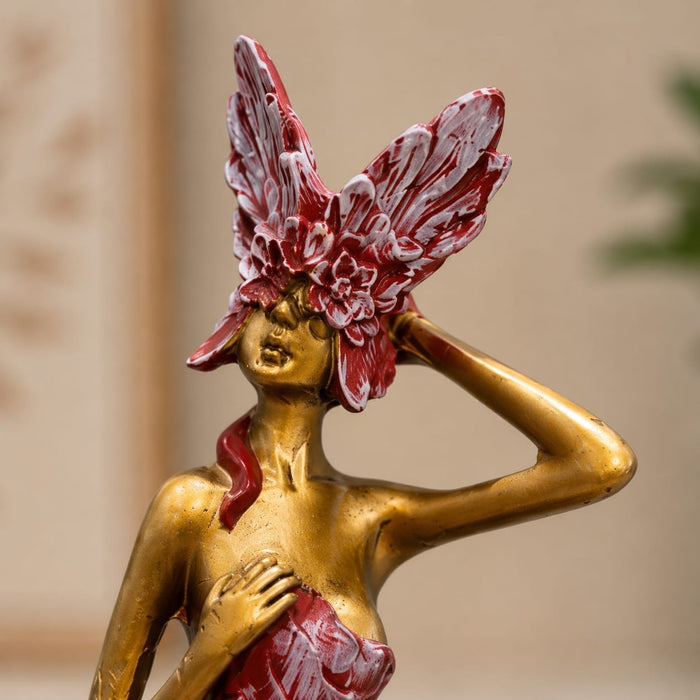 Side profile perspective showcasing elegant three-dimensional contours and sculptural depth of Abstract Golden Female Resin Figurine with Floral Mask (12.3 Inch)
