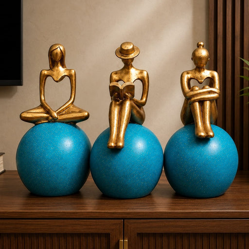 Detailed close-up of hand-painted accents, fine facial detailing, and premium Resin texture on Abstract Golden Women on Blue Spheres 3-Piece Resin Set (11 Inch)