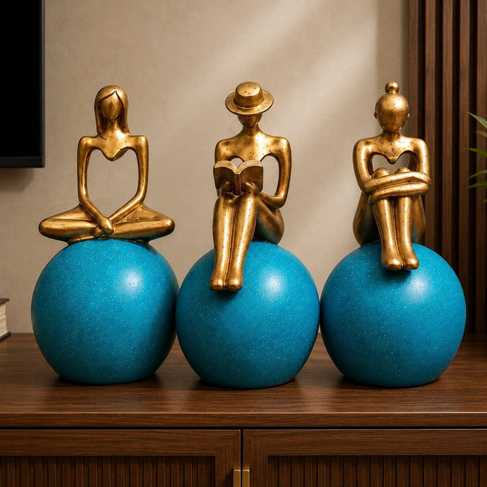 Detailed close-up of hand-painted accents, fine facial detailing, and premium Resin texture on Abstract Golden Women on Blue Spheres 3-Piece Resin Set (11 Inch)