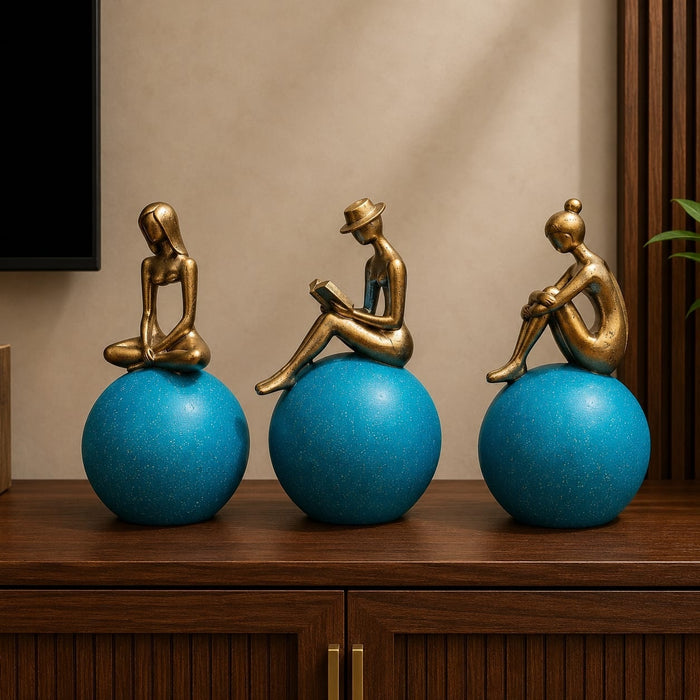 Full front view of Abstract Golden Women on Blue Spheres 3-Piece Resin Set (11 Inch) on display base against clean studio background