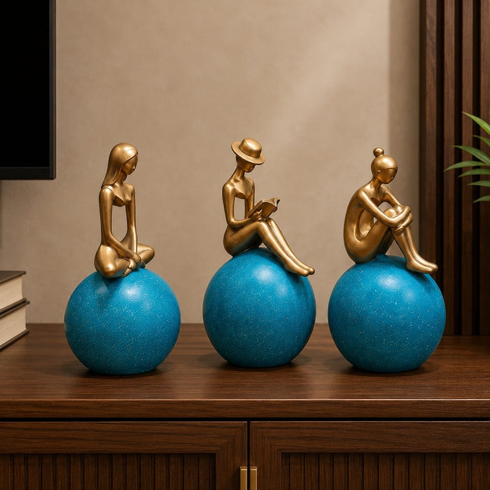 Side profile perspective showcasing elegant three-dimensional contours and sculptural depth of Abstract Golden Women on Blue Spheres 3-Piece Resin Set (11 Inch)