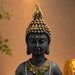 A close-up detail shot of the Black Meditating Buddha Idol focusing on the artisanal carving and rich color.