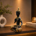 The Black Meditating Buddha Idol beautifully styled in a modern home interior setting to inspire decor placement.