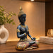 A side profile view of the Black Meditating Buddha Idol revealing its graceful silhouette.
