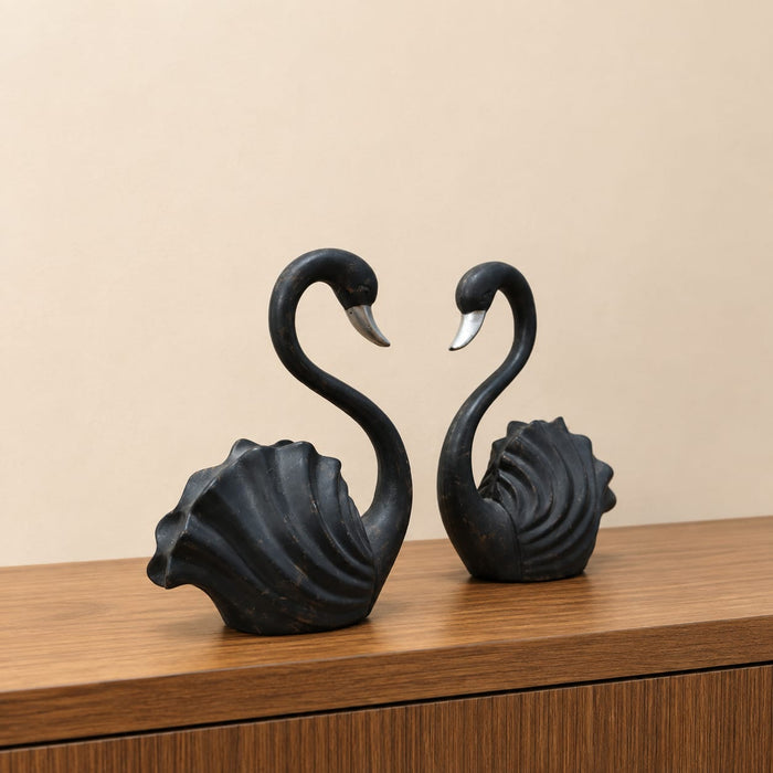 The detailed back view of the Black Swan Pair Figurine showing the intricate texture of the material.