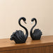 The detailed back view of the Black Swan Pair Figurine showing the intricate texture of the material.