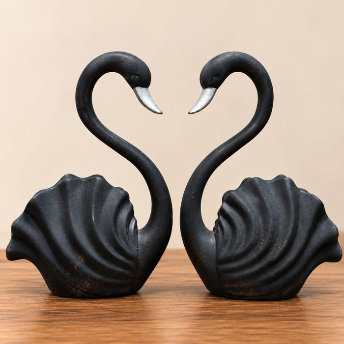 A direct front-facing view of the Black Swan Pair Figurine showcasing its vibrant details and premium finish.