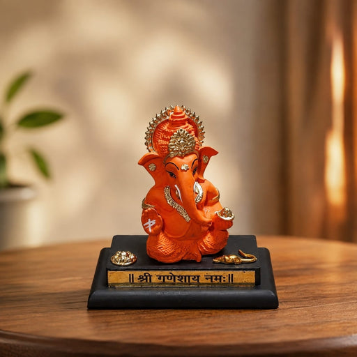 Product feature highlights and craftsmanship overview infographic for Bright Orange Ganesha Resin Idol for Car Dashboard (4.2 Inch)