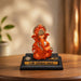 Product feature highlights and craftsmanship overview infographic for Bright Orange Ganesha Resin Idol for Car Dashboard (4.2 Inch)