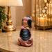 An angled perspective of the Brown Sitting Beagle Figurine highlighting its elegant three-dimensional form and craftsmanship.
