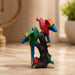 Three-quarter perspective angle view showcasing dynamic form and balanced proportions of Colorful Double Macaw Parrots on Branch Resin Sculpture (9 Inch)
