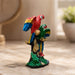 Product feature highlights and craftsmanship overview infographic for Colorful Double Macaw Parrots on Branch Resin Sculpture (9 Inch)
