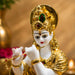 Detailed close-up of hand-painted accents, fine facial detailing, and premium Resin texture on Divine Lord Krishna Playing Flute with Cow Resin Idol (12.5 Inch)