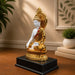 Side profile perspective showcasing elegant three-dimensional contours and sculptural depth of Glossy Gold and White Meditating Buddha Resin Statue with Halo (12.3 Inch)