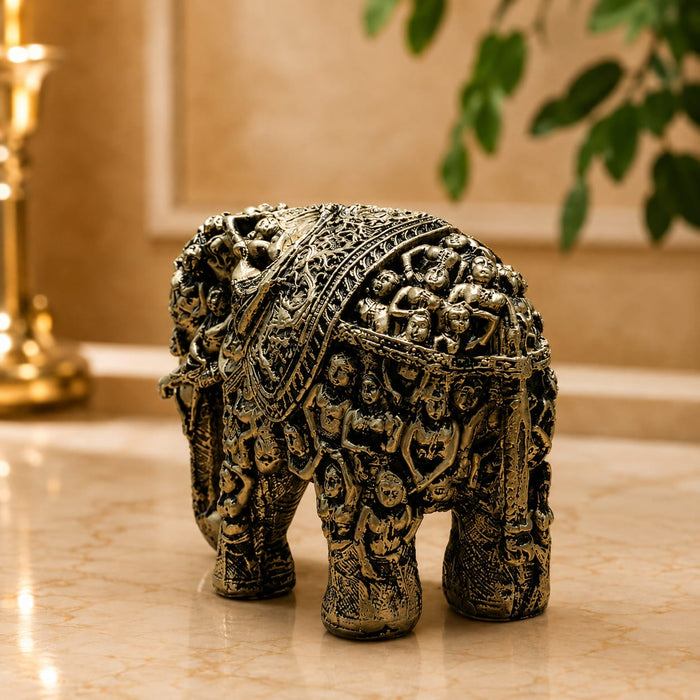 The detailed back view of the Gold Antique Elephant Figurine showing the intricate texture of the material.