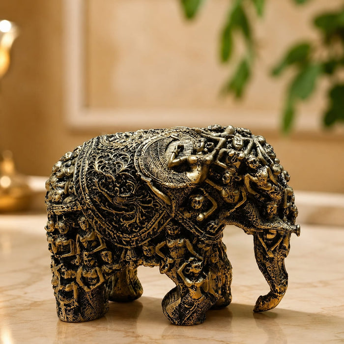 A close-up detail shot of the Gold Antique Elephant Figurine focusing on the artisanal carving and rich color.