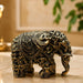 A close-up detail shot of the Gold Antique Elephant Figurine focusing on the artisanal carving and rich color.