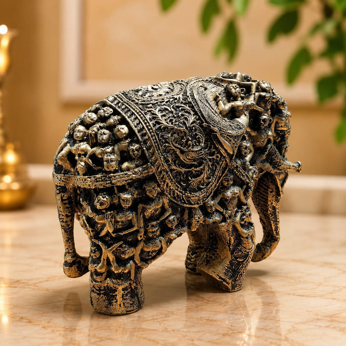 The Gold Antique Elephant Figurine beautifully styled in a modern home interior setting to inspire decor placement.