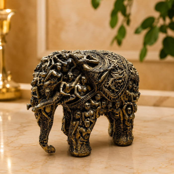 A side profile view of the Gold Antique Elephant Figurine revealing its graceful silhouette.