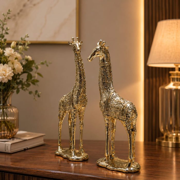 A close-up detail shot of the Gold Deer Pair Figurine focusing on the artisanal carving and rich color.