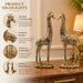 A side profile view of the Gold Deer Pair Figurine revealing its graceful silhouette.