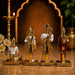 A close-up detail shot of the Gold Ram Darbar Murti focusing on the artisanal carving and rich color.