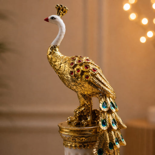 An angled perspective of the Gold Standing Peacock Figurine highlighting its elegant three-dimensional form and craftsmanship.