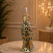 The detailed back view of the Gold Standing Peacock Figurine showing the intricate texture of the material.