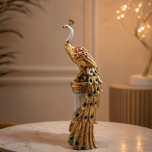 A close-up detail shot of the Gold Standing Peacock Figurine focusing on the artisanal carving and rich color.