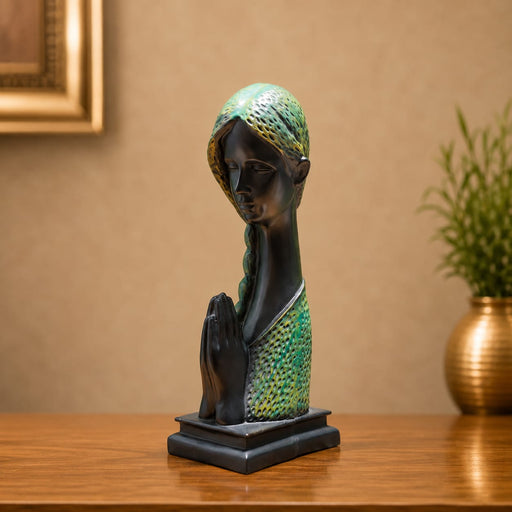 An angled perspective of the Green Abstract Face Sculpture highlighting its elegant three-dimensional form and craftsmanship.
