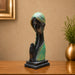 An angled perspective of the Green Abstract Face Sculpture highlighting its elegant three-dimensional form and craftsmanship.