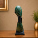 A direct front-facing view of the Green Abstract Face Sculpture showcasing its vibrant details and premium finish.