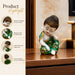 A direct front-facing view of the Green Little Buddha Figurine showcasing its vibrant details and premium finish.
