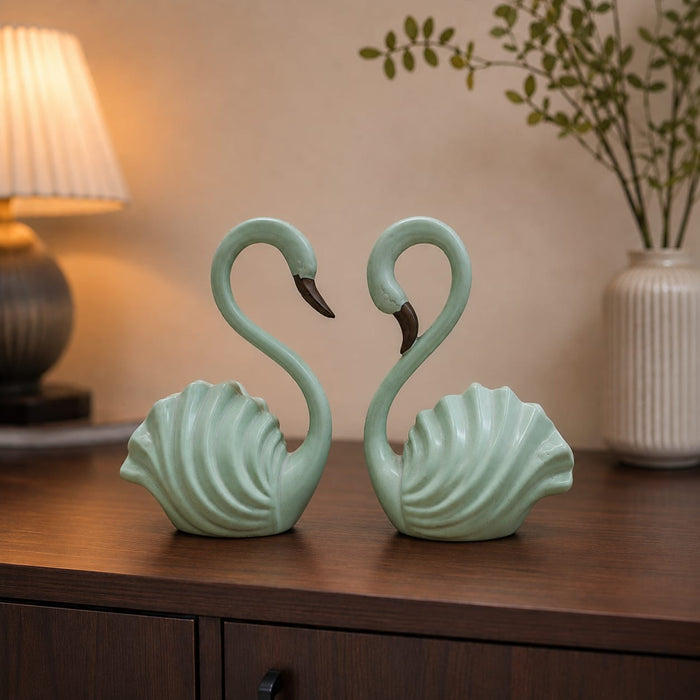 The detailed back view of the Green Swan Pair Figurine showing the intricate texture of the material.
