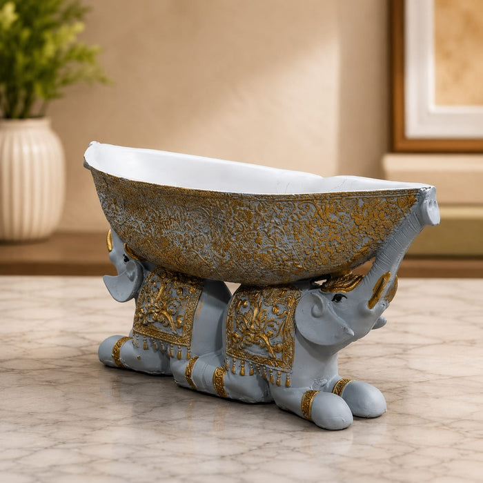 Side profile perspective showcasing elegant three-dimensional contours and sculptural depth of Large Boat-Shaped Dual Elephant Resin Catchall Bowl (6.1 Inch)