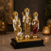 The detailed back view of the Large Gold Ram Darbar Idol showing the intricate craftsmanship of their garments and crowns.