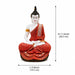 Three-quarter perspective angle view showcasing dynamic form and balanced proportions of Meditating Buddha Resin Statue in Red and Gold Robe (11.5 Inch)