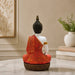 High-resolution craftsmanship detail shot displaying intricate ornamental work on Meditating Buddha Resin Statue in Red and Gold Robe (11.5 Inch)