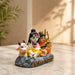 Side profile perspective showcasing elegant three-dimensional contours and sculptural depth of Miniature Multicolor Shiv Parivar Resin Car Dashboard Idol (2.8 Inch)