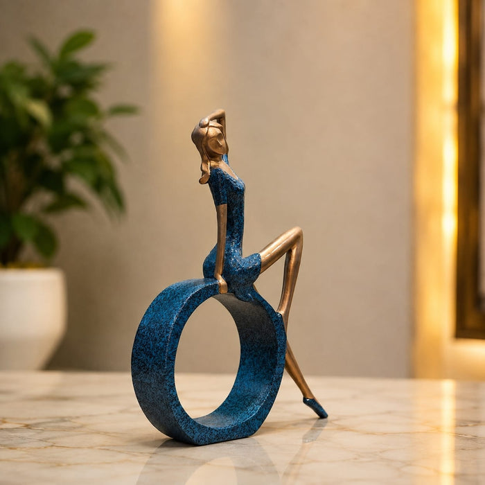 Three-quarter perspective angle view showcasing dynamic form and balanced proportions of Modern Abstract Blue Woman on Ring Resin Sculpture (11.5 Inch)
