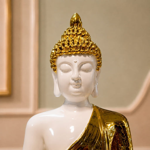 Detailed close-up of hand-painted accents, fine facial detailing, and premium Resin texture on Modern White and Gold Meditating Buddha Resin Statue (15.3 Inch)
