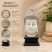 Detailed close-up of hand-painted accents, fine facial detailing, and premium Resin texture on Modern White and Silver Buddha Head on Black Base Resin Showpiece (11.2 Inch)